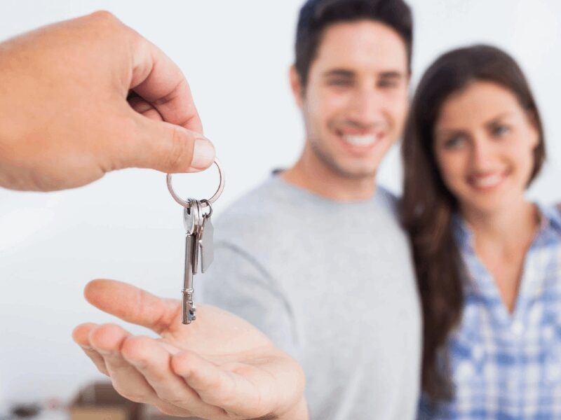 Man Being Given a House Key