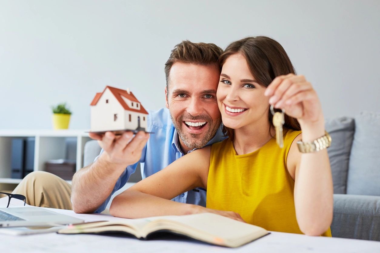 Happy Couple Holding Keys to New Home